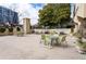 Community patio area with tables, chairs, planters, and built-in grills, perfect for outdoor entertaining at 2479 Peachtree Ne Rd # 605, Atlanta, GA 30305