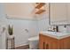 Stylish powder room with wooden vanity, light blue paneled walls and modern fixtures at 3667 Peachtree Ne Rd # 16, Atlanta, GA 30319