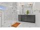 Modern bathroom with marble tile, glass shower, and double vanity sinks at 3667 Peachtree Ne Rd # 16, Atlanta, GA 30319