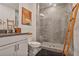 Modern bathroom featuring a glass shower, gray tile and wood accent ladder at 3667 Peachtree Ne Rd # 16, Atlanta, GA 30319