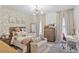 Cozy bedroom with stylish wallpaper, a soft bed, and bright natural light at 3667 Peachtree Ne Rd # 16, Atlanta, GA 30319
