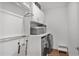 Well-organized laundry area with washer, dryer and shelving for ample storage at 3667 Peachtree Ne Rd # 16, Atlanta, GA 30319