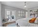 Serene bedroom with neutral tones, a ceiling fan, and a French door leading to balcony at 3667 Peachtree Ne Rd # 16, Atlanta, GA 30319