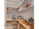Organized pantry with shelves stocked with food, baskets, and kitchen essentials at 3667 Peachtree Ne Rd # 16, Atlanta, GA 30319