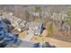 Aerial view of a two-story house and neighborhood at 1868 Lakeview Bend Way, Buford, GA 30519