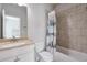 Simple bathroom with shower/tub combo and updated vanity at 1868 Lakeview Bend Way, Buford, GA 30519