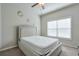 Bedroom with ceiling fan, neutral walls, and carpet floors at 1868 Lakeview Bend Way, Buford, GA 30519