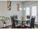 Breakfast nook with glass table, four chairs, and access to backyard at 1868 Lakeview Bend Way, Buford, GA 30519
