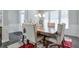 Bright dining room with a rustic wood table and six elegant chairs at 1868 Lakeview Bend Way, Buford, GA 30519