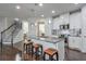 Modern kitchen with white cabinets, granite countertops, and kitchen island at 1868 Lakeview Bend Way, Buford, GA 30519
