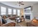Spacious living room with fireplace, large sectional sofa, and flat-screen TV at 1868 Lakeview Bend Way, Buford, GA 30519