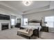 Luxurious main bedroom with a fireplace and a king-size bed at 1868 Lakeview Bend Way, Buford, GA 30519