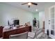 Home office with built-in desk and French doors leading to unfinished basement at 1868 Lakeview Bend Way, Buford, GA 30519