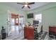 Home office with wood desk, providing access to unfinished basement at 1868 Lakeview Bend Way, Buford, GA 30519