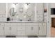 Double vanity bathroom with granite countertop, large mirrors, and ample storage at 2195 Morgan Ne Rd, Marietta, GA 30066