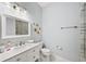 Bathroom with single vanity, shower, and white tile at 2195 Morgan Ne Rd, Marietta, GA 30066