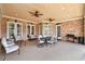 Spacious covered patio with ceiling fans, seating, and a grill at 2195 Morgan Ne Rd, Marietta, GA 30066