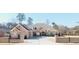 Brick house with a large driveway and three-car garage at 2195 Morgan Ne Rd, Marietta, GA 30066