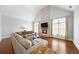 Cozy Gathering room boasts hardwood floors, a large sectional sofa, and a stone fireplace at 2195 Morgan Ne Rd, Marietta, GA 30066