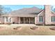 Brick house exterior with a covered patio and landscaped yard at 2195 Morgan Ne Rd, Marietta, GA 30066