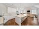 Open concept kitchen boasts white cabinets, large island, and hardwood floors at 2195 Morgan Ne Rd, Marietta, GA 30066