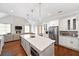 Modern kitchen with white cabinets, large island with breakfast bar, and stainless steel appliances at 2195 Morgan Ne Rd, Marietta, GA 30066