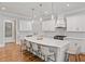 White kitchen features a large island with seating and hardwood floors at 2195 Morgan Ne Rd, Marietta, GA 30066