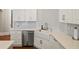 Modern kitchen with white cabinetry, farm sink, and quartz countertops at 2195 Morgan Ne Rd, Marietta, GA 30066
