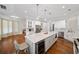 Gourmet kitchen with white cabinets, large island, and stainless steel appliances at 2195 Morgan Ne Rd, Marietta, GA 30066