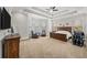 Spacious main bedroom with plush carpet, ceiling fan, and sitting area at 2195 Morgan Ne Rd, Marietta, GA 30066