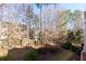 Spacious backyard with mature trees and a partially visible fence at 2969 Rivergreen Se Ln, Atlanta, GA 30339