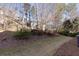 Spacious backyard with mature trees and a partially fenced area at 2969 Rivergreen Se Ln, Atlanta, GA 30339