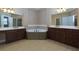 Large bathroom with corner tub and double vanity at 2969 Rivergreen Se Ln, Atlanta, GA 30339