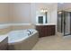 Bathroom with corner tub, double vanity, and shower at 2969 Rivergreen Se Ln, Atlanta, GA 30339