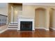 Living room fireplace with hardwood floors and neutral walls at 2969 Rivergreen Se Ln, Atlanta, GA 30339