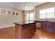 Kitchen features a large kitchen island with granite countertop at 2969 Rivergreen Se Ln, Atlanta, GA 30339