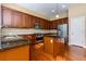 Modern kitchen with island, granite countertops, and stainless steel appliances at 2969 Rivergreen Se Ln, Atlanta, GA 30339