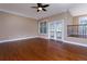 Living room with hardwood floors, fireplace and access to balcony at 2969 Rivergreen Se Ln, Atlanta, GA 30339