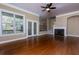 Large living room with hardwood floors, fireplace, and balcony access at 2969 Rivergreen Se Ln, Atlanta, GA 30339