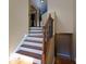 Elegant wooden staircase with wrought iron railings at 2969 Rivergreen Se Ln, Atlanta, GA 30339