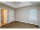 Spacious bedroom with ceiling fan and neutral walls at 5010 Mundy Dr, Cumming, GA 30028