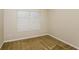 Spacious bedroom with carpet flooring and window at 5010 Mundy Dr, Cumming, GA 30028