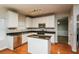 Kitchen with island, granite countertops, and stainless steel appliances at 5010 Mundy Dr, Cumming, GA 30028