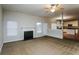 Open living room with kitchen views and fireplace at 5010 Mundy Dr, Cumming, GA 30028