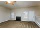 Spacious living room with fireplace and carpet flooring at 5010 Mundy Dr, Cumming, GA 30028