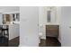 View of a half-bath featuring modern fixtures, vanity with storage, and dark wood flooring at 504 Rankin Ne St # 4, Atlanta, GA 30308