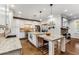 Open kitchen with granite island, white cabinets, and a stone fireplace at 916 Cardova Ne Dr, Atlanta, GA 30324