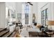 Sunlit living room featuring a fireplace, large windows, and comfortable seating at 1919 Galt Commons, Kennesaw, GA 30144