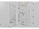 Sleek bathroom with marble tiled shower, glass door, and gold shower fixtures at 2753 Camp Branch Rd, Buford, GA 30519