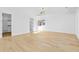 Bright bedroom with hardwood floors, modern lighting, a large closet, and a view from the window at 2753 Camp Branch Rd, Buford, GA 30519